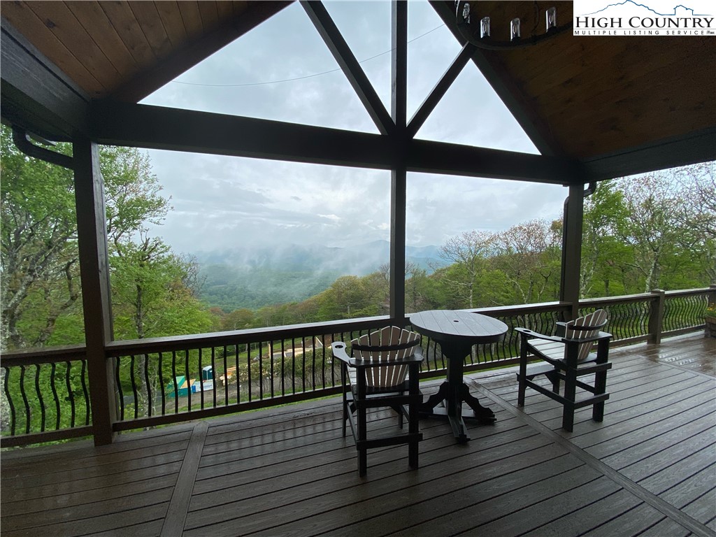 543 Broken Arrow Trail Boone, NC 28607 - Photo 30 of 35 a view of a chairs and table on the wooden deck