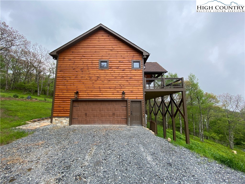 543 Broken Arrow Trail Boone, NC 28607 - Photo 3 of 35 a view of a house with a yard