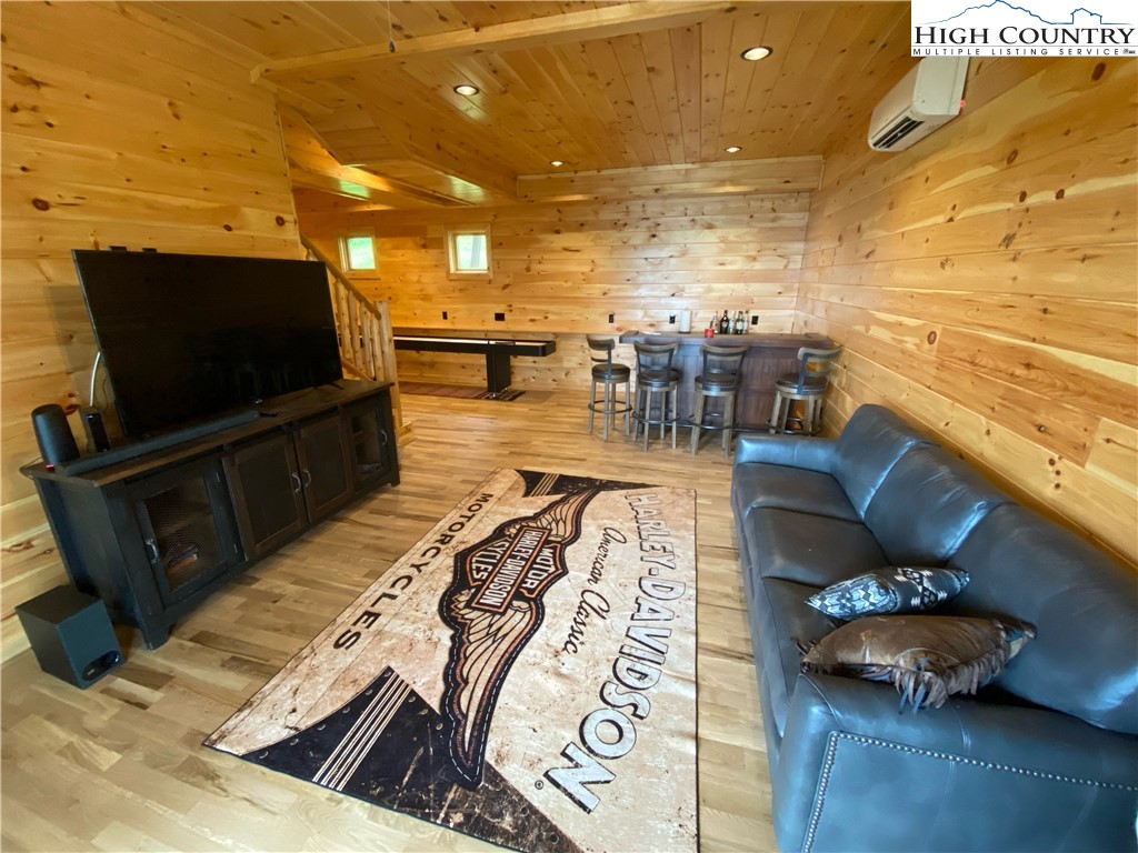 543 Broken Arrow Trail Boone, NC 28607 - Photo 10 of 35 a living room with furniture and a flat screen tv