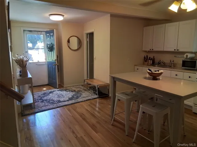 a kitchen with a table and chairs in it