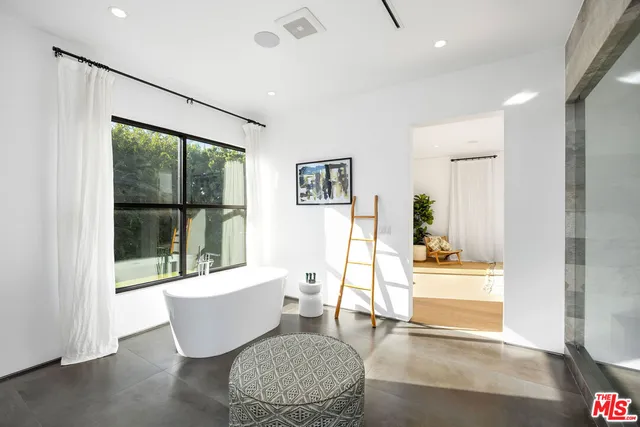 a living room with furniture and a window with outer view
