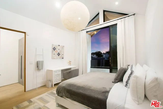 a bedroom with a bed and a walk in closet