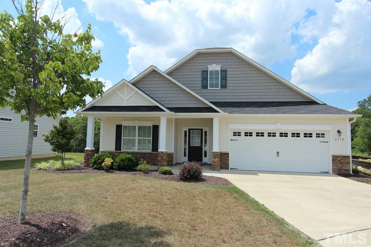 6312 Slopeside Court Raleigh, NC 27610 - Photo 2 of 22 a front view of a house with a yard