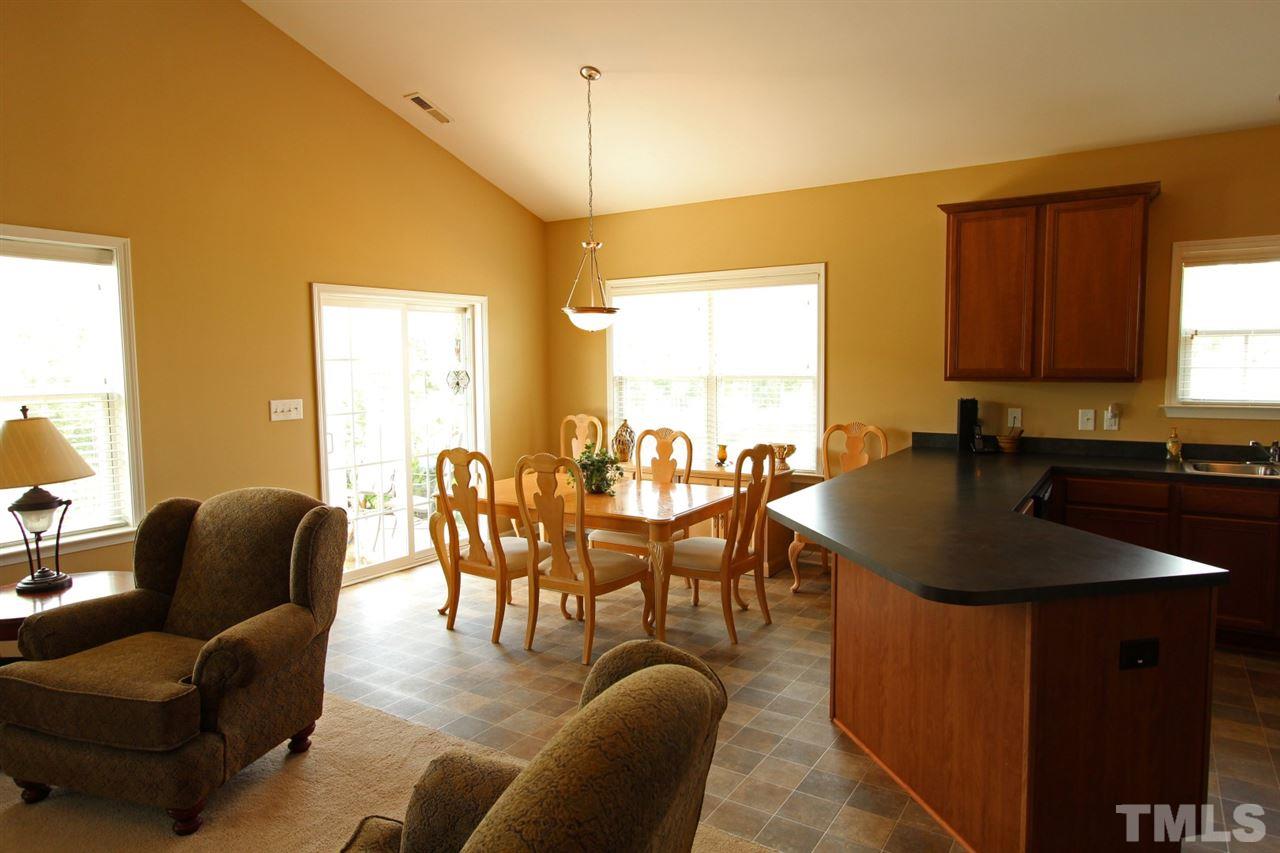 6312 Slopeside Court Raleigh, NC 27610 - Photo 6 of 22 a view of a dining room with furniture and window