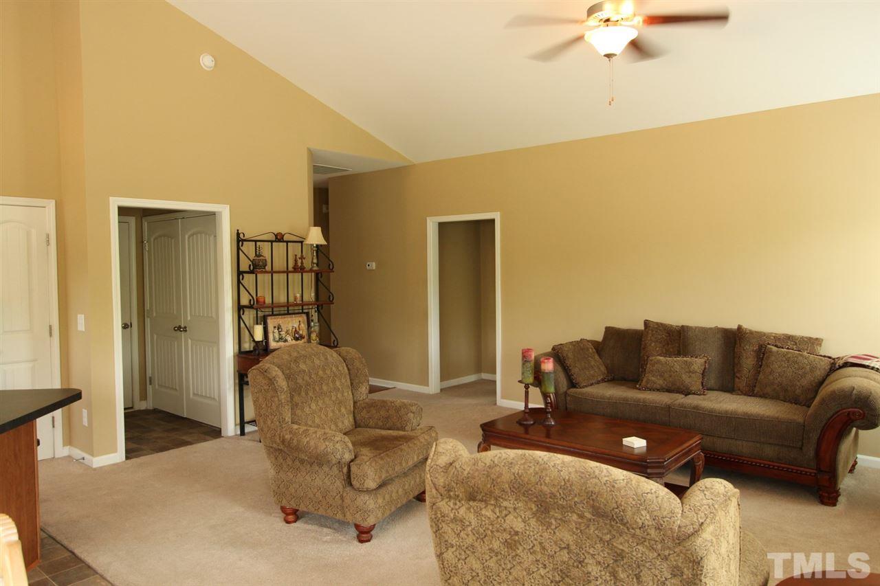 6312 Slopeside Court Raleigh, NC 27610 - Photo 10 of 22 a living room with furniture and a large window