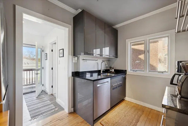 a kitchen with granite countertop a stove and a refrigerator