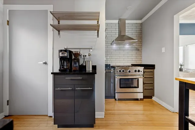 a kitchen with a stove and a refrigerator