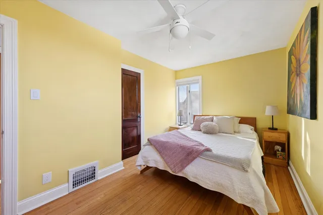 a bathroom with a white tub a sink and a shower