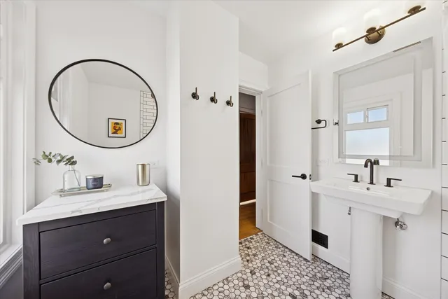 a bathroom with a sink and a mirror