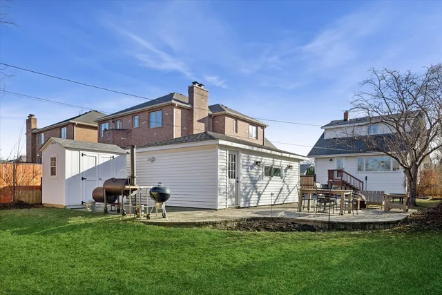 a view of yard with swimming pool and sitting area