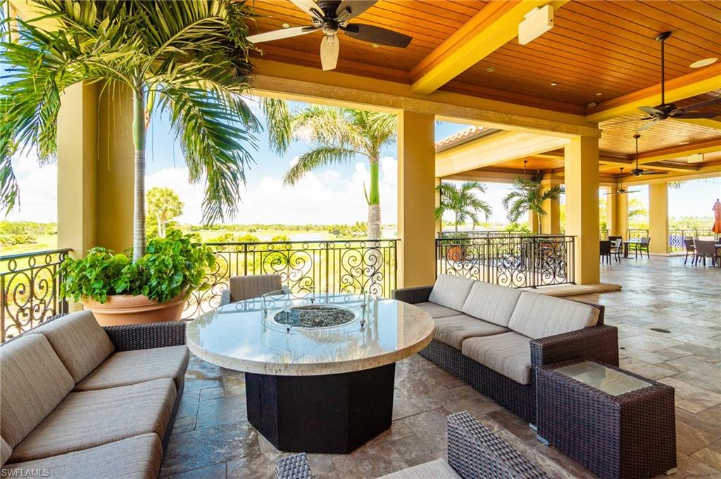 9596 Trevi Court, Unit 5413 Naples, FL 34113 - Photo 22 of 26 a living room with furniture and a large window