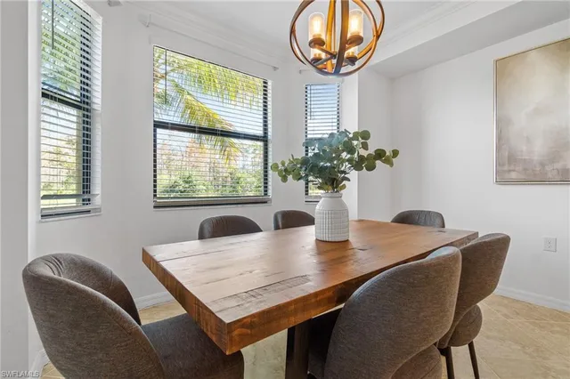 a view of a dining room with furniture and window