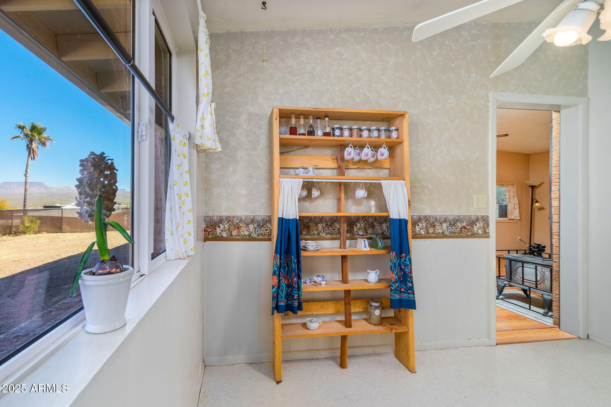 417 West Sunset Drive Mammoth, AZ 85618 - Photo 14 of 35 a view of living room with furniture and floor to ceiling window