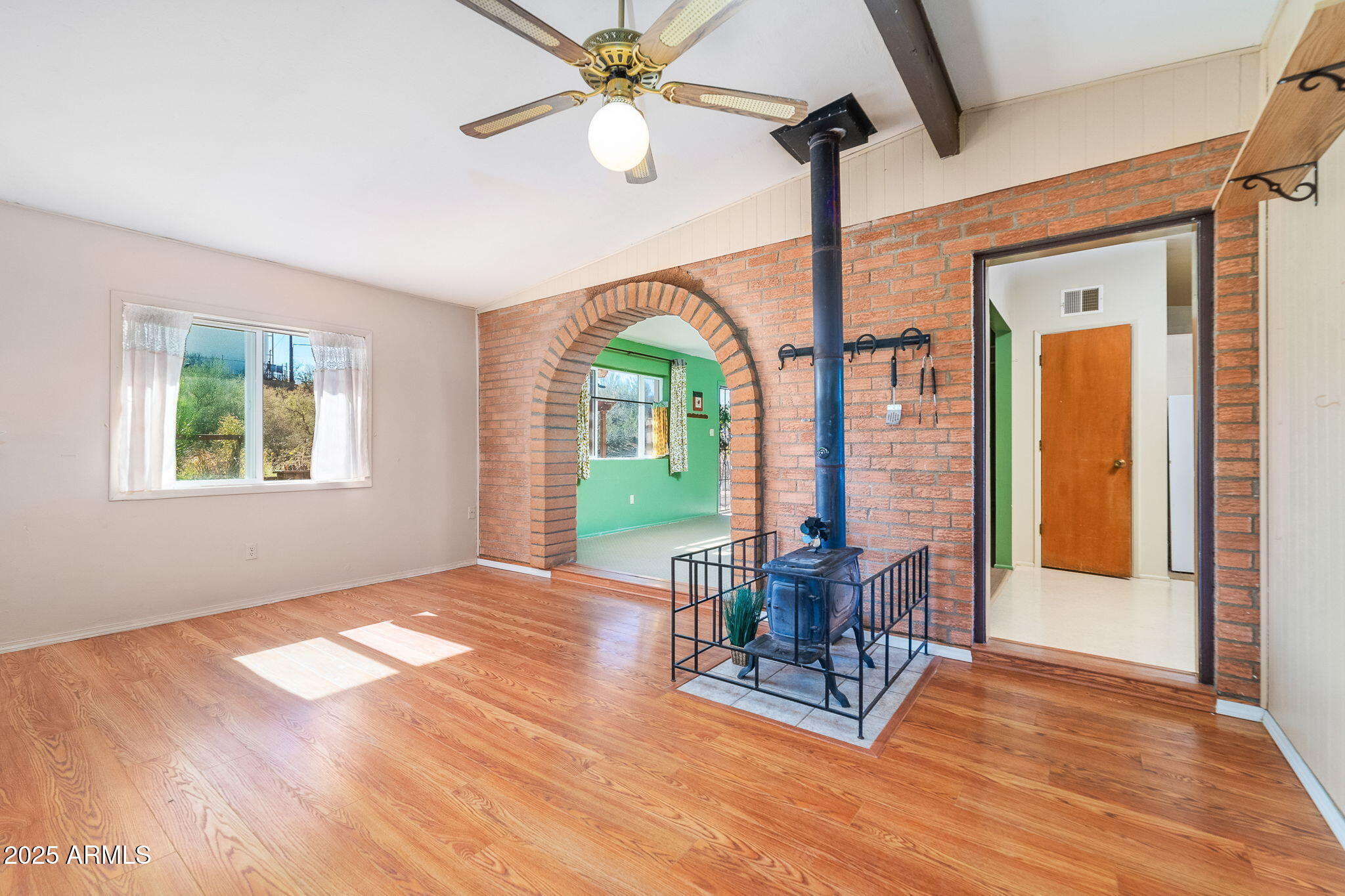 417 West Sunset Drive Mammoth, AZ 85618 - Photo 18 of 35 a view of a room with furniture large windows and wooden floor