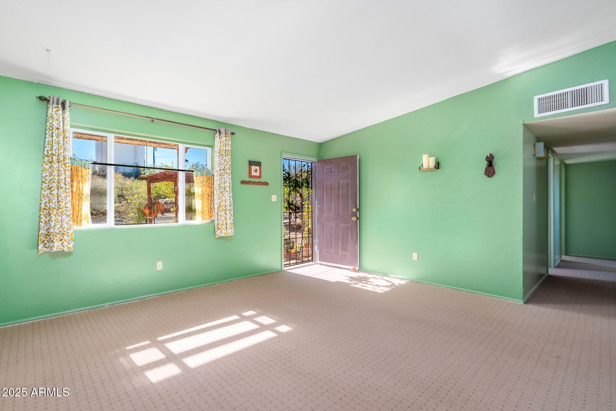 417 West Sunset Drive Mammoth, AZ 85618 - Photo 9 of 35 a view of an empty room with window and stairs