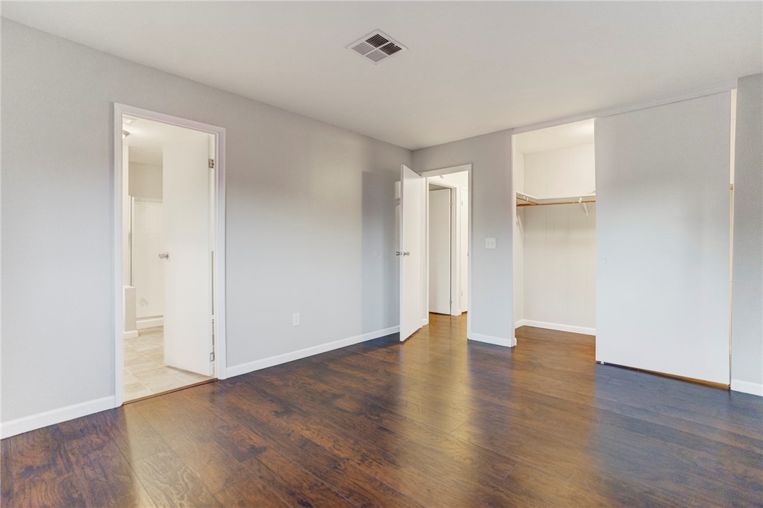 8536 Kern Canyon Road, Unit 184 Bakersfield, CA 93306 - Photo 13 of 28 a view of an empty room with wooden floor