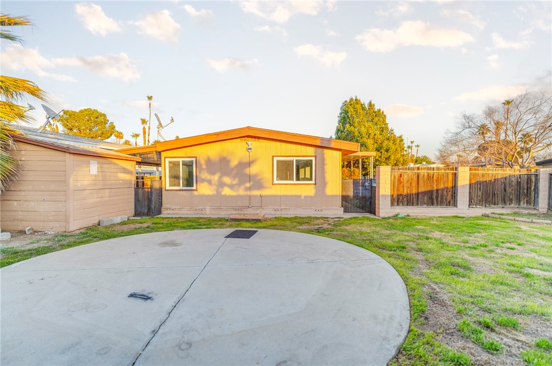 8536 Kern Canyon Road, Unit 184 Bakersfield, CA 93306 - Photo 19 of 28 a view of a house with a yard