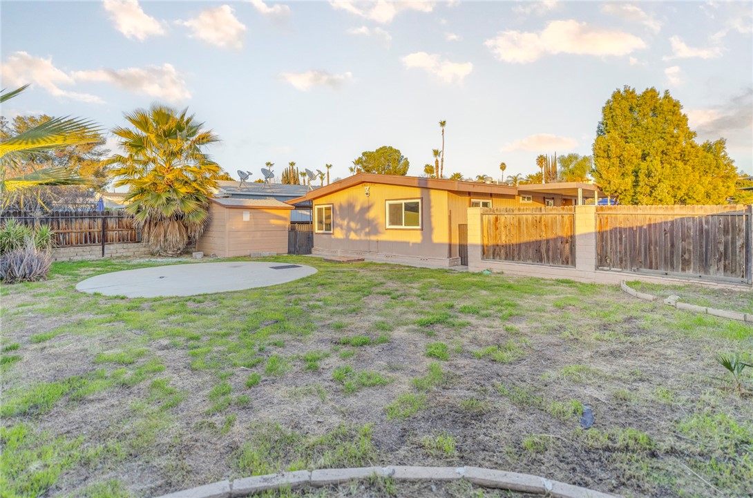 8536 Kern Canyon Road, Unit 184 Bakersfield, CA 93306 - Photo 20 of 28 a view of a house with a yard and a garden