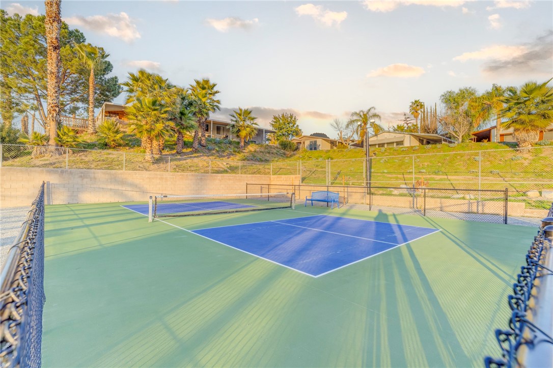 8536 Kern Canyon Road, Unit 184 Bakersfield, CA 93306 - Photo 26 of 28 a swimming pool with lawn chairs