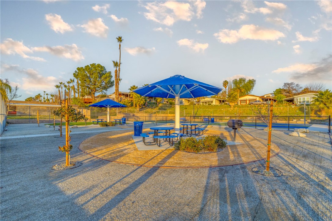 8536 Kern Canyon Road, Unit 184 Bakersfield, CA 93306 - Photo 28 of 28 a view of tennis court with chairs