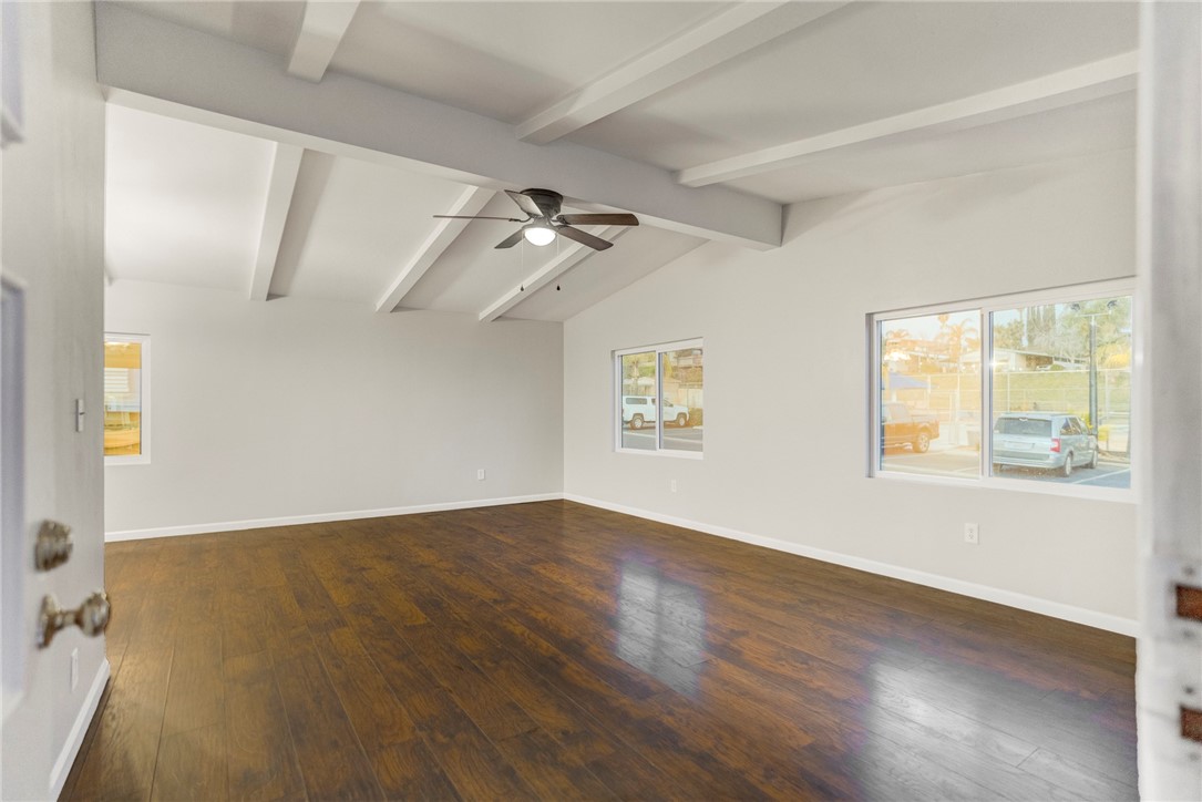 8536 Kern Canyon Road, Unit 184 Bakersfield, CA 93306 - Photo 3 of 28 wooden floor in an empty room with a window