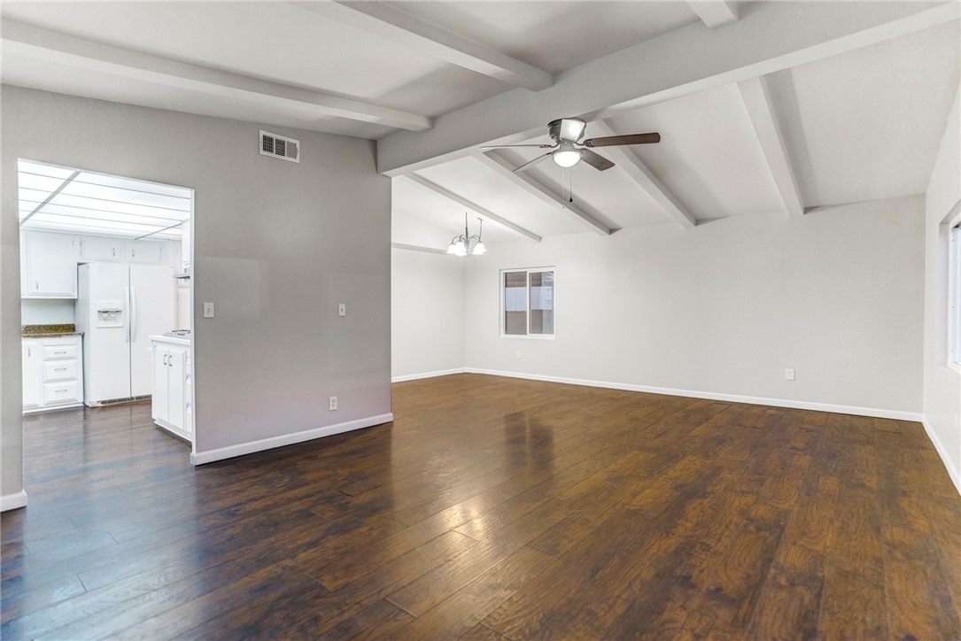 8536 Kern Canyon Road, Unit 184 Bakersfield, CA 93306 - Photo 4 of 28 an empty room with wooden floor and windows