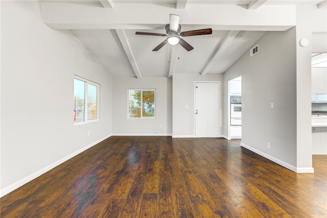 8536 Kern Canyon Road, Unit 184 Bakersfield, CA 93306 - Photo 6 of 28 wooden floor in an empty room with a window