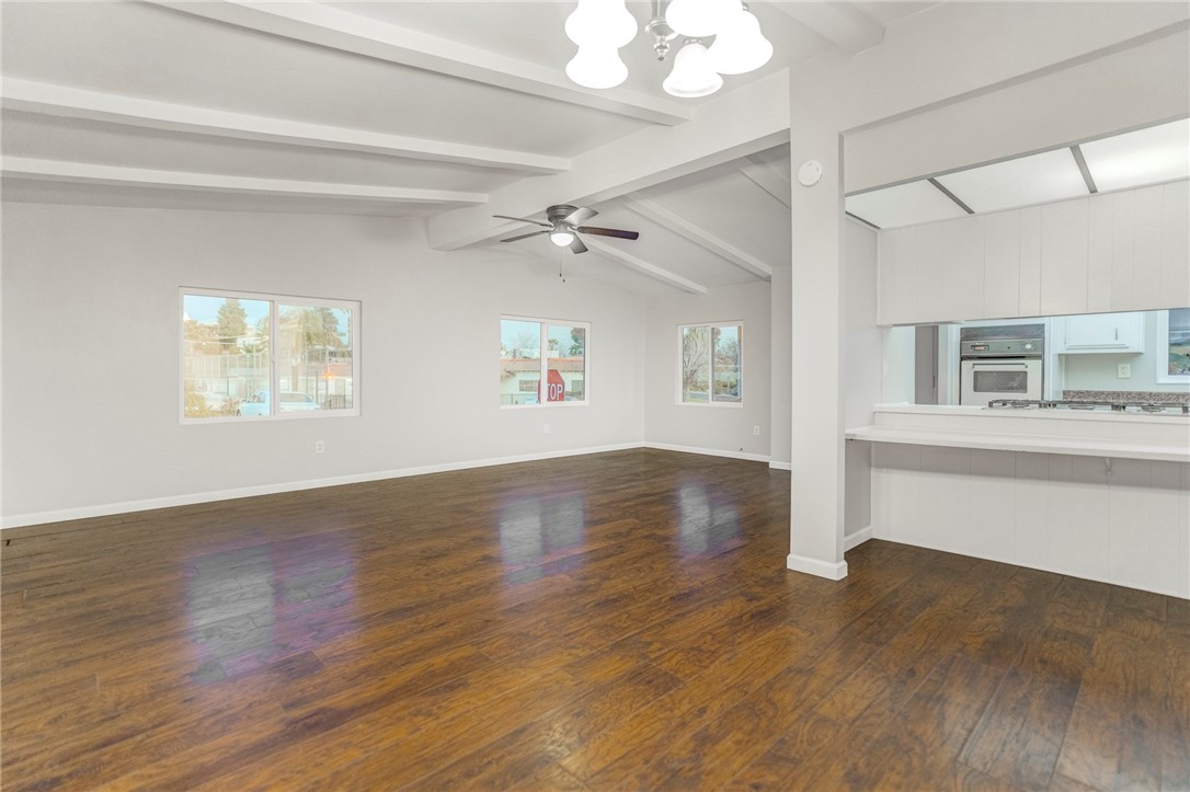8536 Kern Canyon Road, Unit 184 Bakersfield, CA 93306 - Photo 7 of 28 a view of an empty room with wooden floor and a window