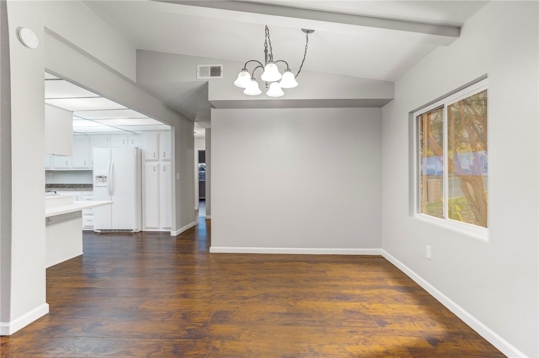 8536 Kern Canyon Road, Unit 184 Bakersfield, CA 93306 - Photo 8 of 28 wooden floor in an empty room with a window
