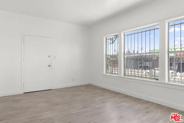 a view of an empty room with a window