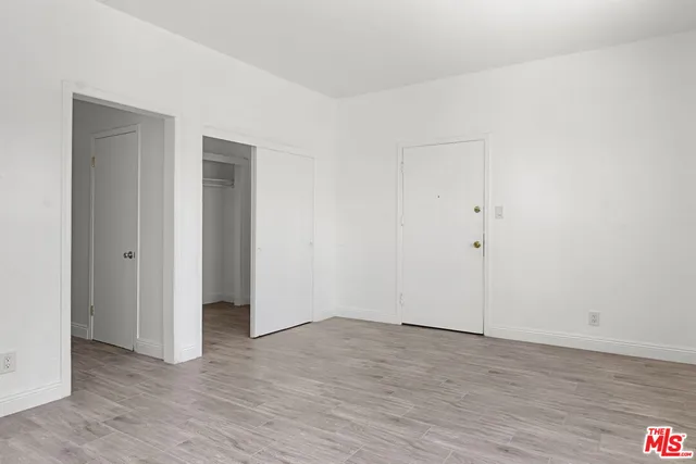 a view of hallway with wooden floor