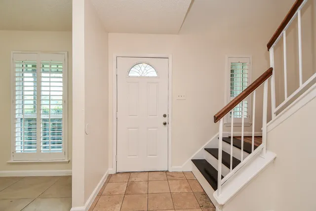 a view of an entryway with staircase