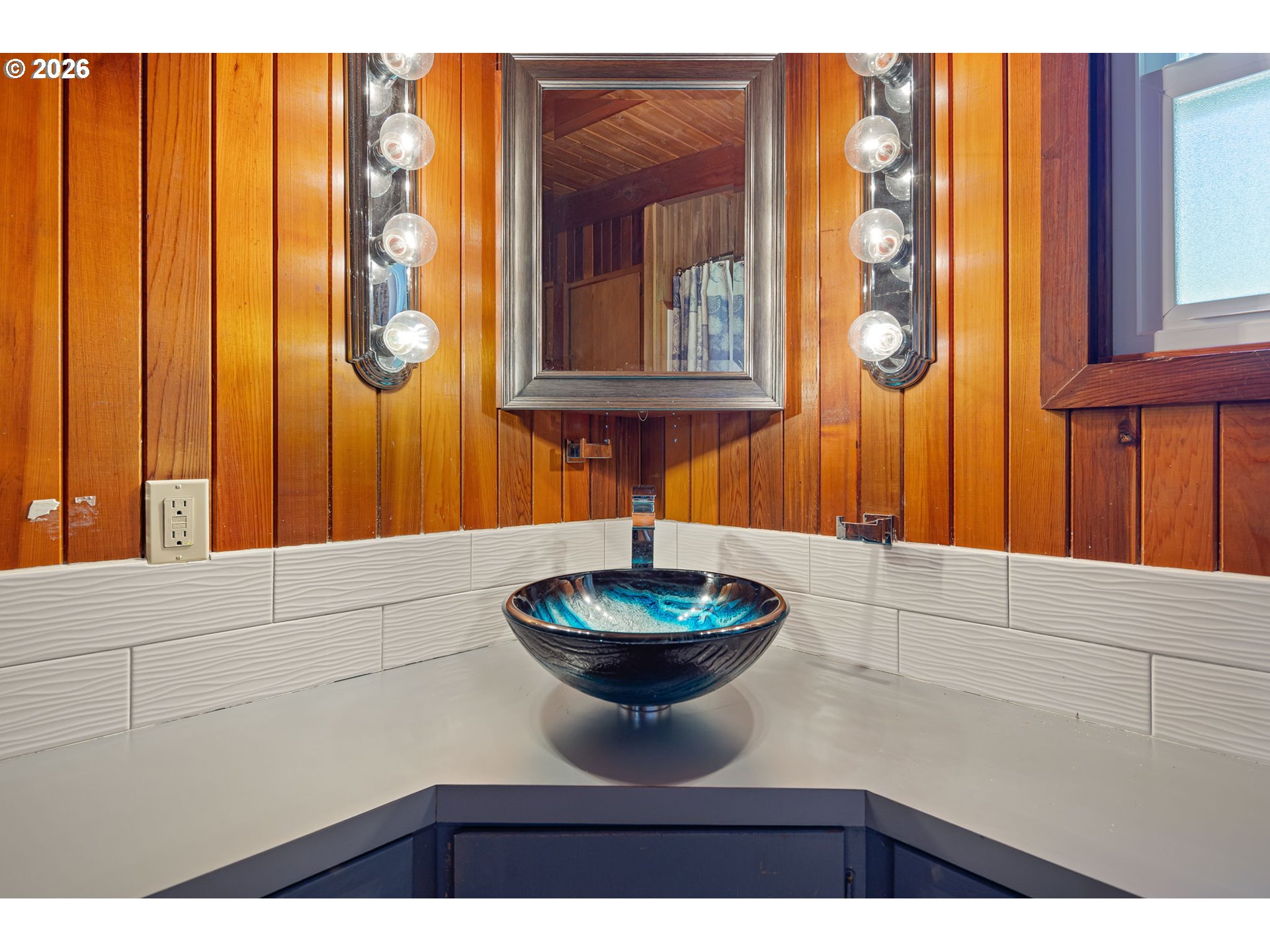 88481 1st Avenue Florence, OR 97439 - Photo 12 of 43 a bathroom with a toilet a sink and mirror