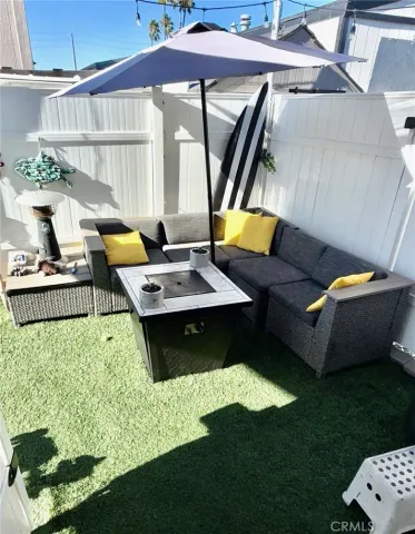 a backyard of a house with table and chairs