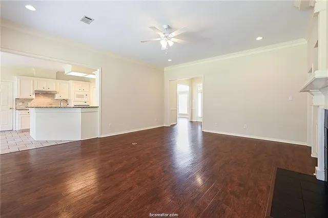a view of a kitchen with a dishwasher cabinets and wooden floor