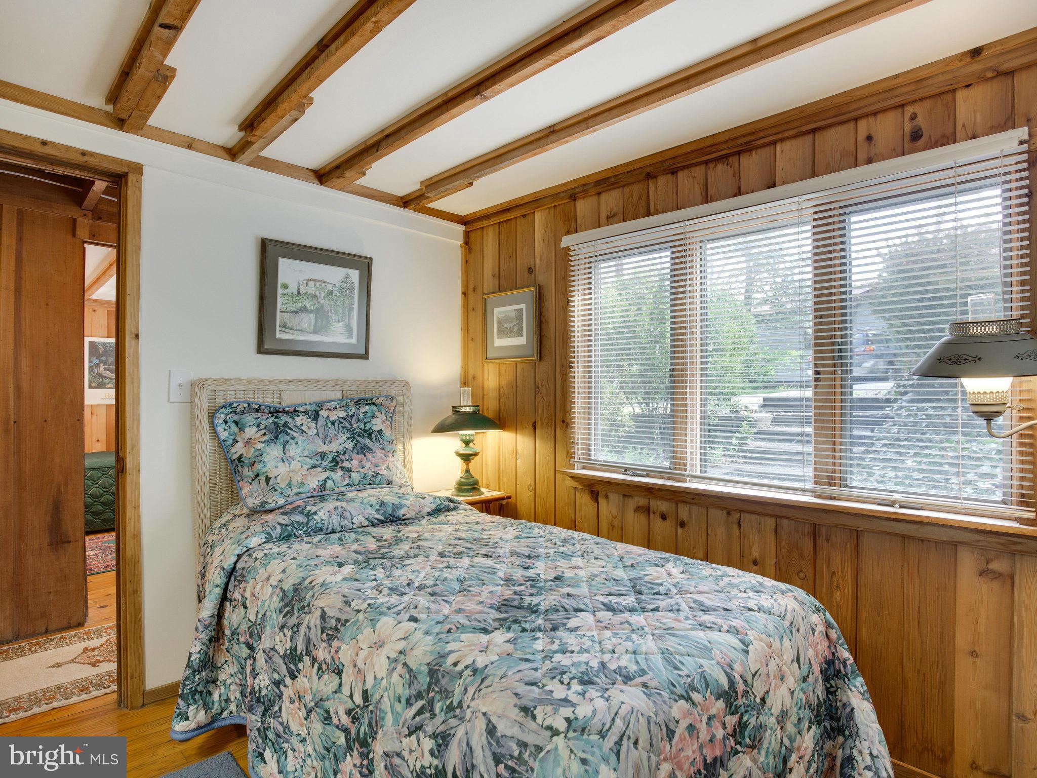 2085 Cherry Road Port Republic, MD 20676 - Photo 22 of 30 a bed sitting in a bedroom next to a window