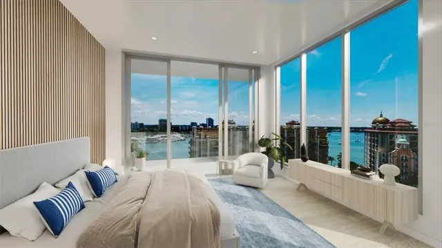 a bedroom with a large bed and a large window