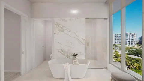 a spacious bathroom with a bathtub and shower