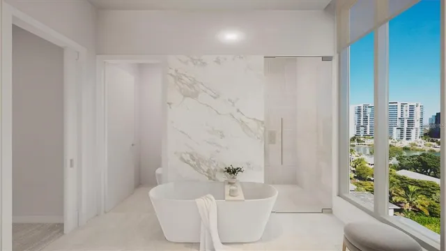 a spacious bathroom with a bathtub and shower