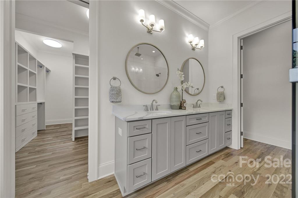 536 Marsh Road Charlotte, NC 28209 - Photo 20 of 41 a bathroom with a double vanity sink and a mirror