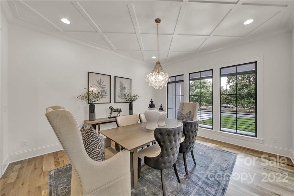 536 Marsh Road Charlotte, NC 28209 - Photo 3 of 41 a view of a dining room with furniture wooden floor and chandelier