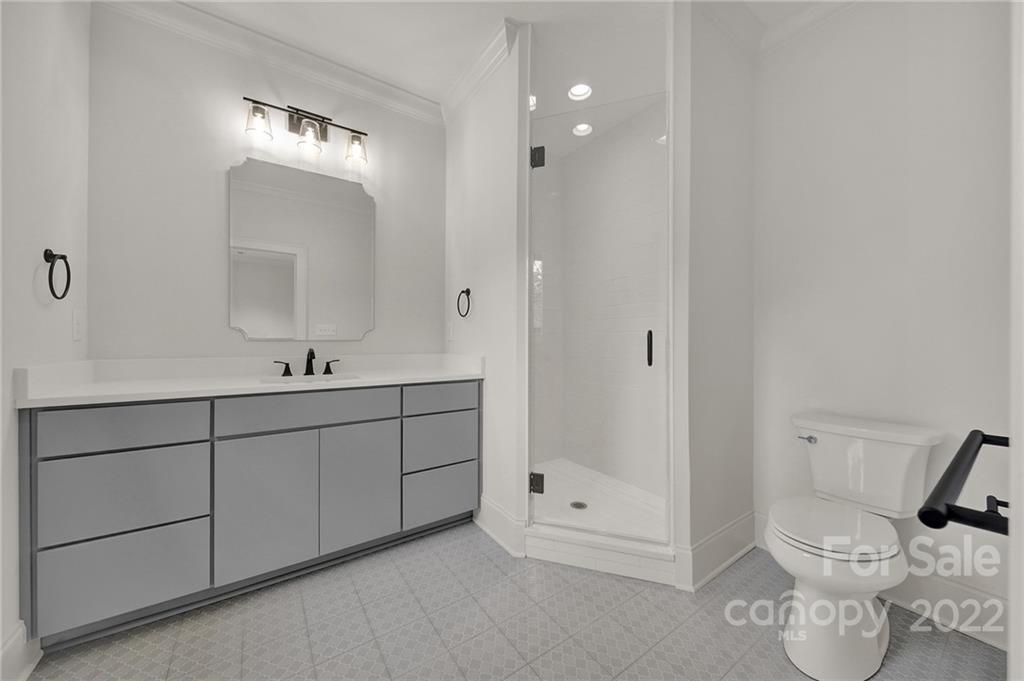 536 Marsh Road Charlotte, NC 28209 - Photo 32 of 41 a bathroom with a toilet sink and shower