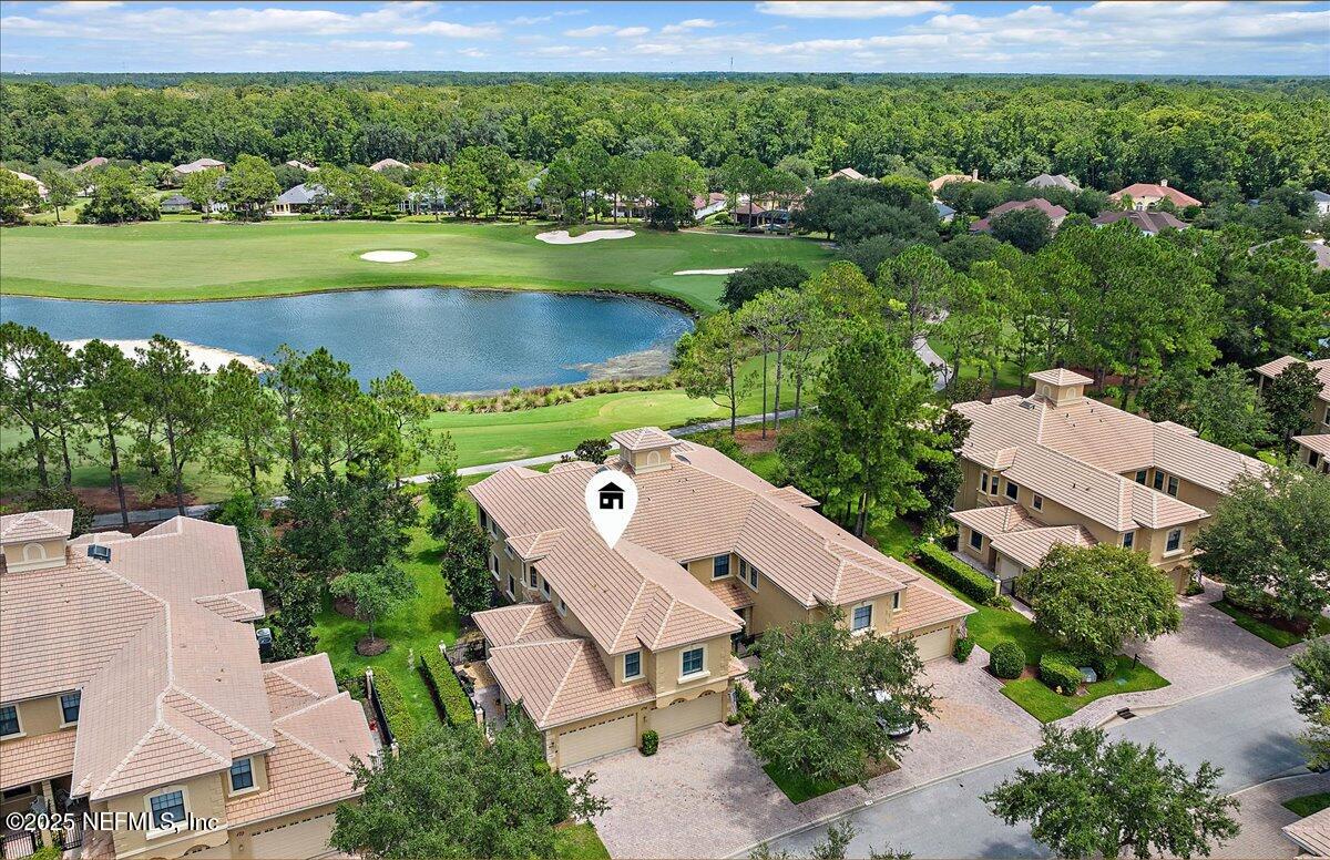 174 Laterra Links Circle, Unit 201 St. Augustine, FL 32092 - Photo 1 of 41 an aerial view of a house with a garden and lake view