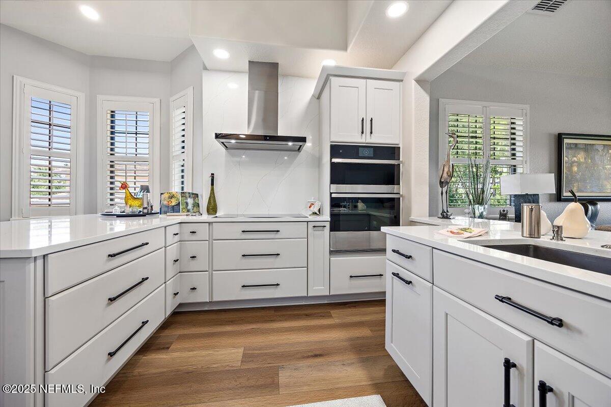 174 Laterra Links Circle, Unit 201 St. Augustine, FL 32092 - Photo 11 of 41 a kitchen with white cabinets and appliances