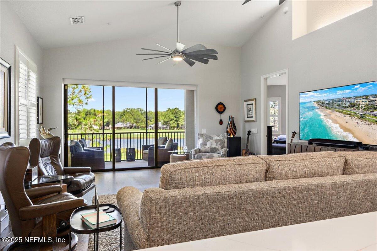 174 Laterra Links Circle, Unit 201 St. Augustine, FL 32092 - Photo 12 of 41 a living room with furniture and large windows