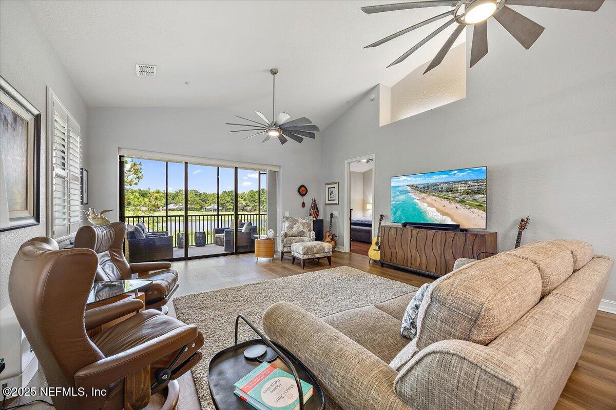 174 Laterra Links Circle, Unit 201 St. Augustine, FL 32092 - Photo 14 of 41 a living room with furniture and a large window