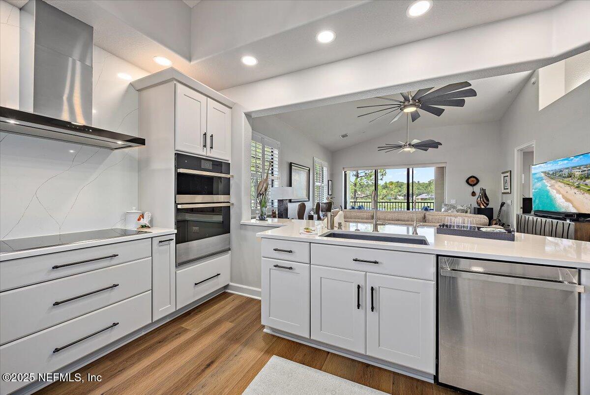 174 Laterra Links Circle, Unit 201 St. Augustine, FL 32092 - Photo 17 of 41 a kitchen with white cabinets and white appliances