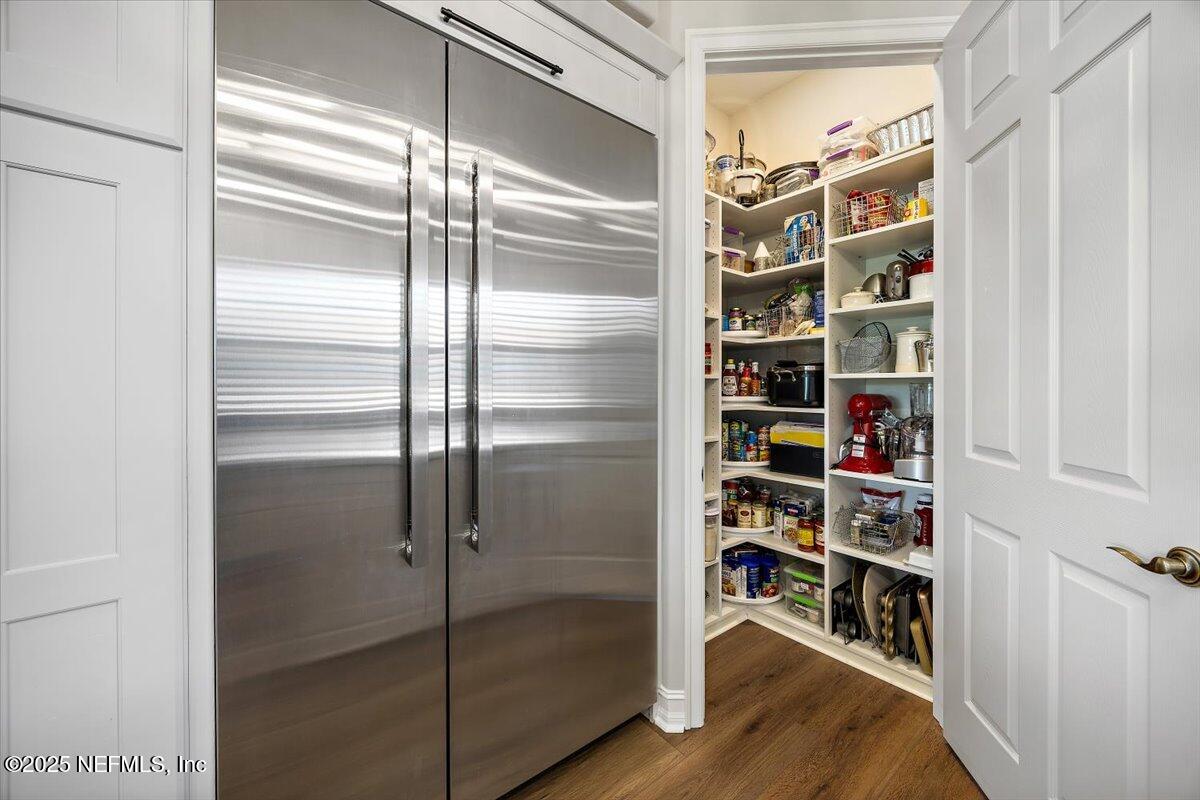 174 Laterra Links Circle, Unit 201 St. Augustine, FL 32092 - Photo 18 of 41 a view of walk in closet with empty racks