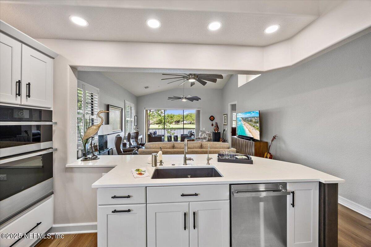 174 Laterra Links Circle, Unit 201 St. Augustine, FL 32092 - Photo 19 of 41 a kitchen with a sink a stove and cabinets