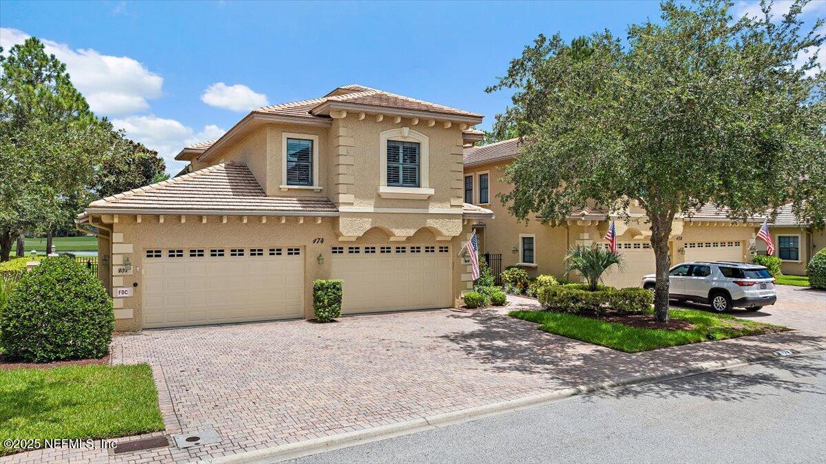 174 Laterra Links Circle, Unit 201 St. Augustine, FL 32092 - Photo 2 of 41 a view of a house with a outdoor space